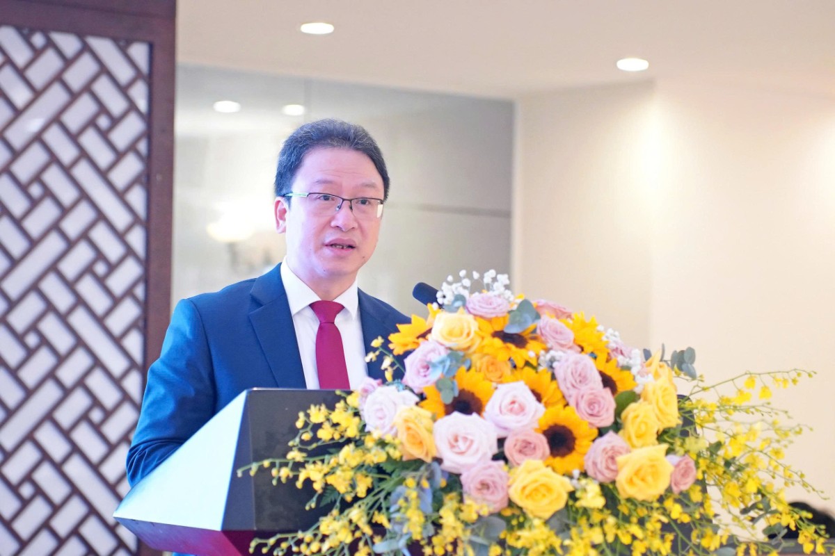 Ông Nguyễn Văn Thanh báo cáo tại hội nghị